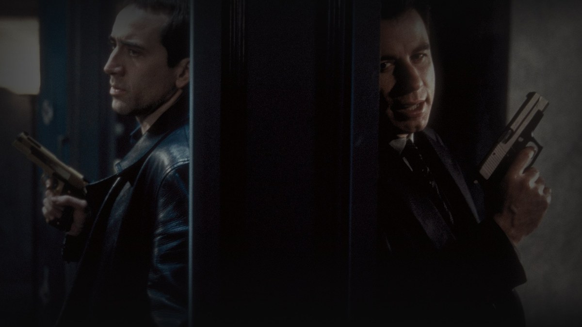 Still from Face/Off (1997) — TMDB backdrop tsSWHgaFlzzkp3o976juBZbmcs2.jpg, selected after checking the Letterboxd og:image and five TMDB backdrop candidates, baked through scripts/bake_dark_photo.py at factor 0.45, output brightness 18.2