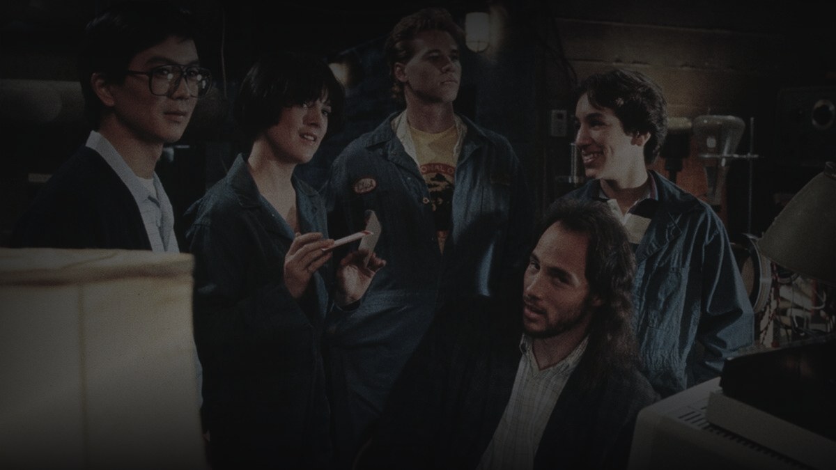 Still from Real Genius (1985) — letterboxd, pre-darkened 0.85, baked 0.45